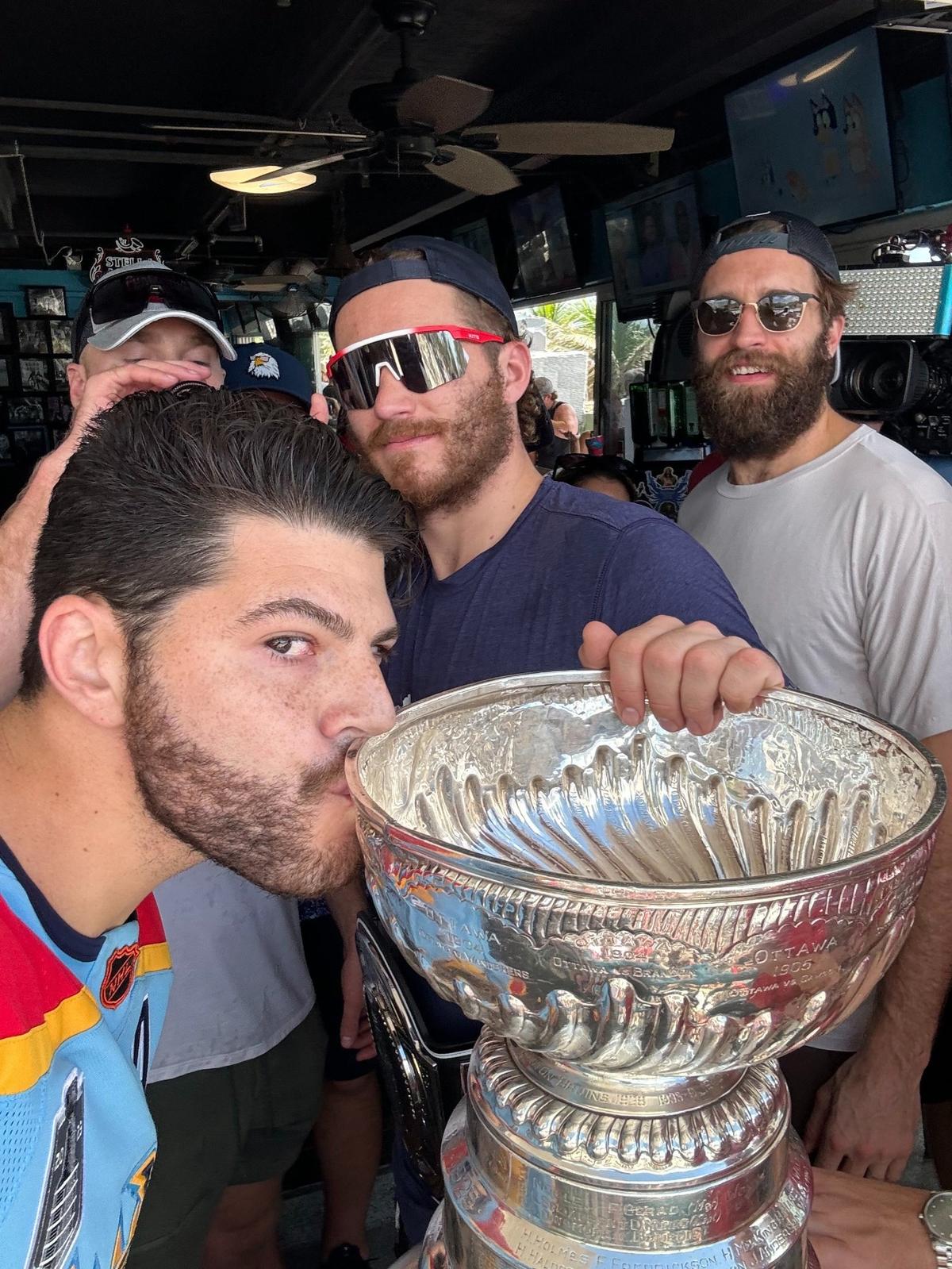 Florida Panthers fan Jake Levine celebrates with Panthers Matthew Tkachuk and Aaron Ekblad at the Elbo Room in Fort Lauderdale on Tuesday, June 25, 2024, one day after the Panthers won the Stanley Cup.