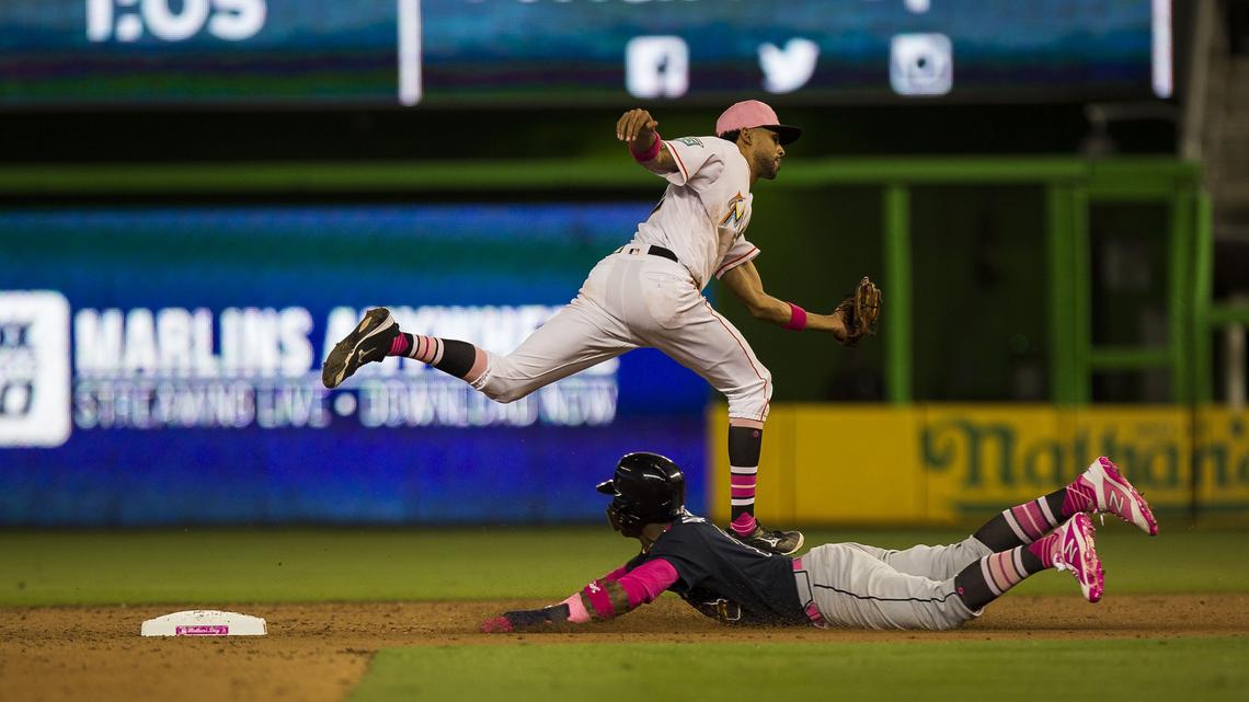 Miami Marlins shortstop Yadiel Rivera (2) misses the catch to get an out at second during the fourth inning of a baseball game against the Atlanta Braves at Marlins Park on Sunday, May 13, 2018, in Miami, FL.