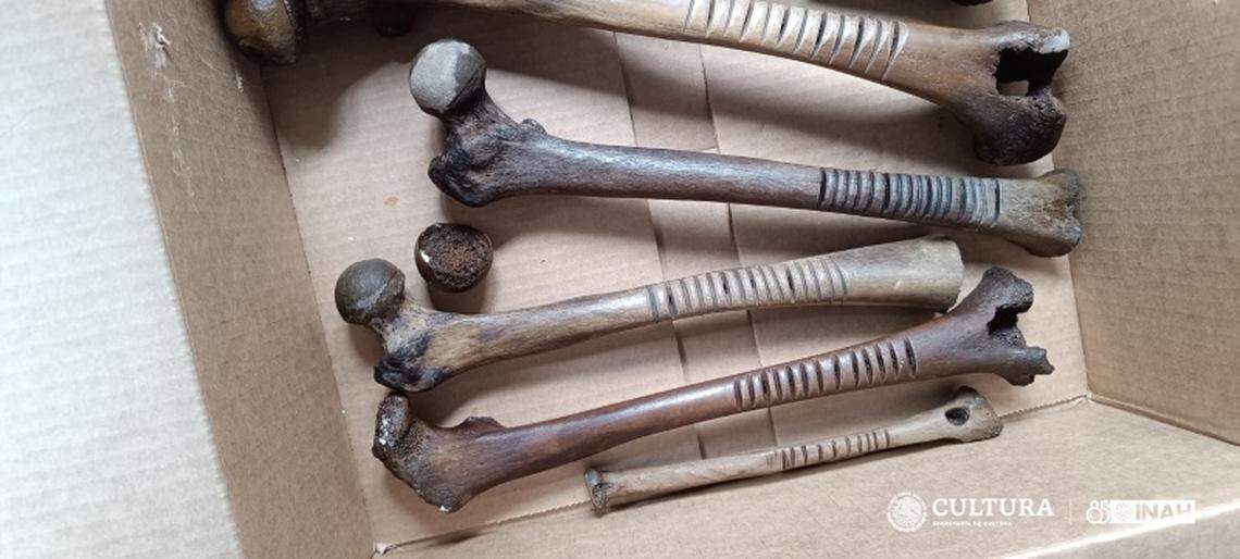 Human bones, mainly femurs, that had been worked and carved were found thrown into the lake.