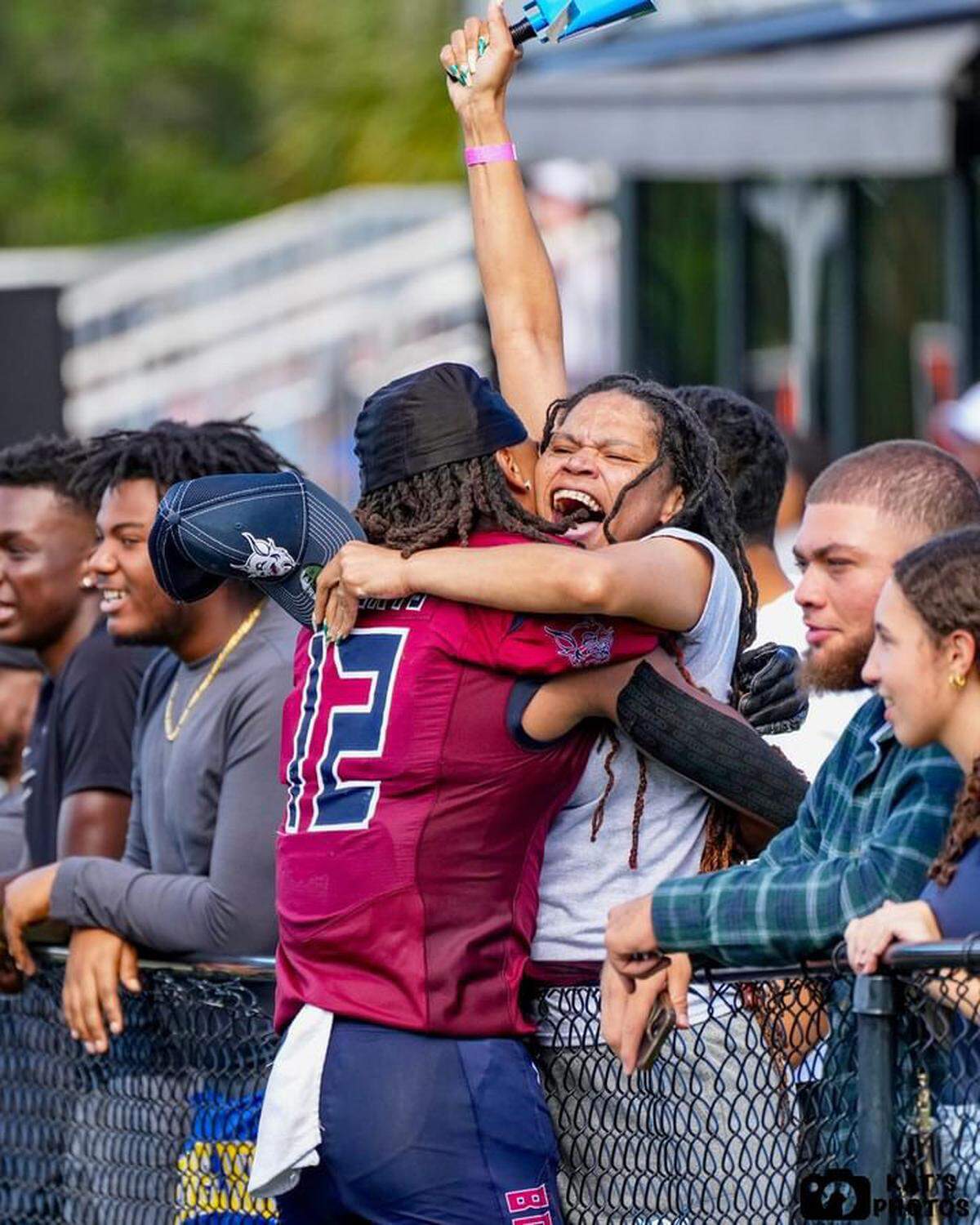 STU receiver David Hayes hugs his mother, Treymayne Hayes, during a game last season.