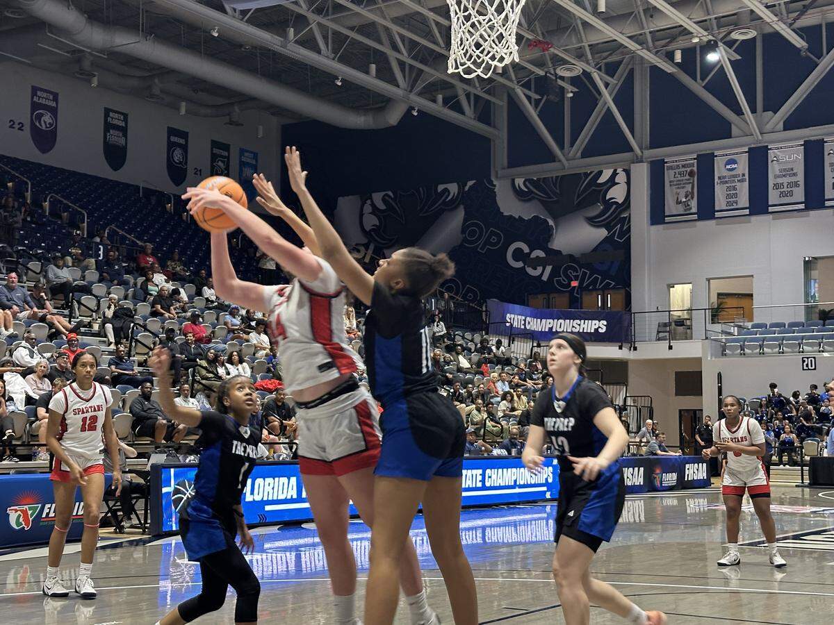 Miami Country Day’s Casey O’Connell goes up for a shot and gets fouled during Friday’s Class 2A girls’ basketball state semifinal at UNF Arena in Jacksonville, Fla.