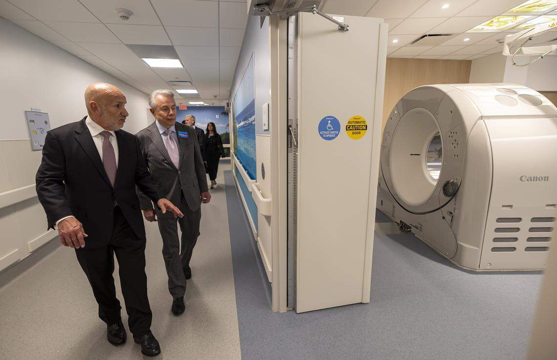 Carlos Migoya, outgoing Jackson Health System chief executive officer, left, gives Benjamin Leon, Jr., founder of Leon Medical Centers, a tour of a new emergency room at Jackson Memorial Hospital on Thursday, April 16, 2026, in Miami, Fla.