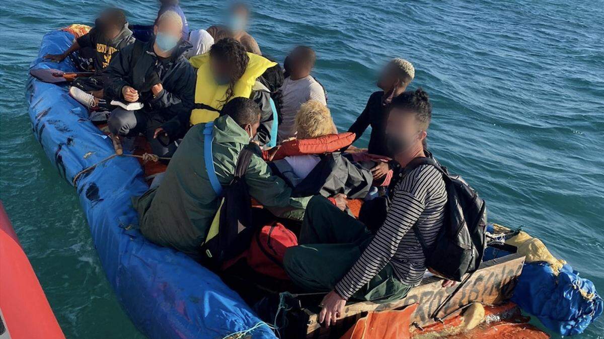 A Coast Guard Station Islamorada smallboat crew stops Cuban migrants near Key Largo, Florida, April 16, 2021. The men were taken back to Cuba Tuesday, April 20, 2021.