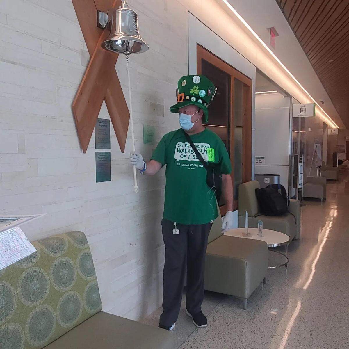 Coral Gables football coach Frank Welsh rings the bell at the Baptist Cancer Institute in Miami after undergoing his final chemotherapy treatment earlier this year. Welsh has been coaching the Cavaliers while battling stage 3b colon cancer.