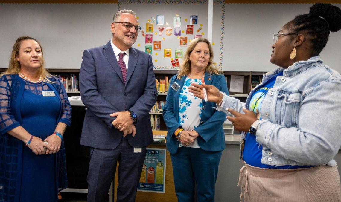 North Lauderdale, August 21, 2023 - Broward School Board member Lori Alhadeff, left, Superintendent Peter Licata, center, and Broward School Board member Debra Hixon talk to Broadview Elementary School’s Media Specialist Eyovne Wishart during a visit on the first day of school in Broward County.