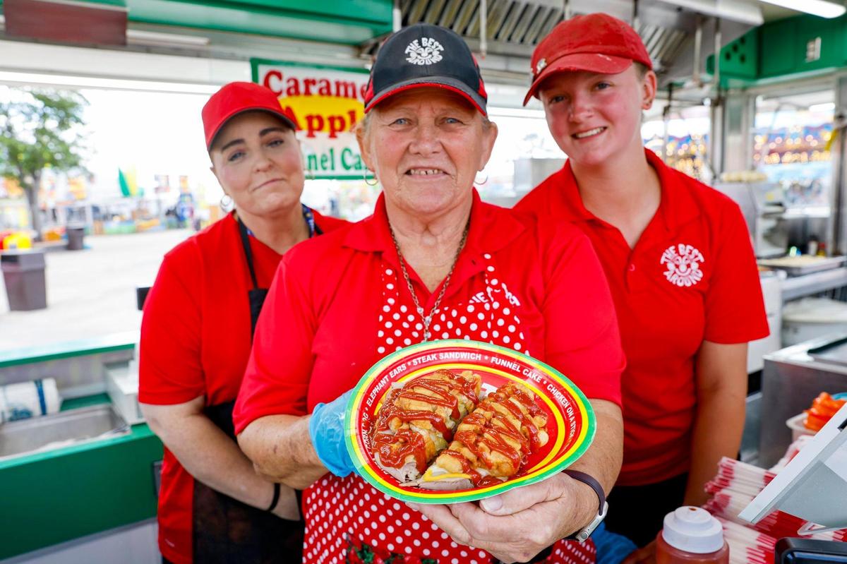 ‘Mama Jane’ Harris displays the Cuban funnel cake sandwich during the opening day of the Miami-Dade County Fair & Exposition.