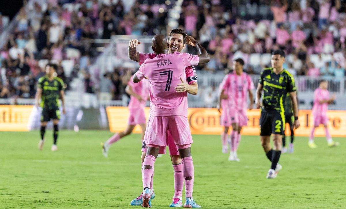 Inter Miami midfielder Fafà Picault (7) celebrates with forward Lionel Messi (10) after scoring a goal against Columbus Crew goalkeeper Nicholas Hagen (1) in the second half of their MLS match at Chase Stadium on Saturday, May 31, 2025, in Fort Lauderdale, Fla.