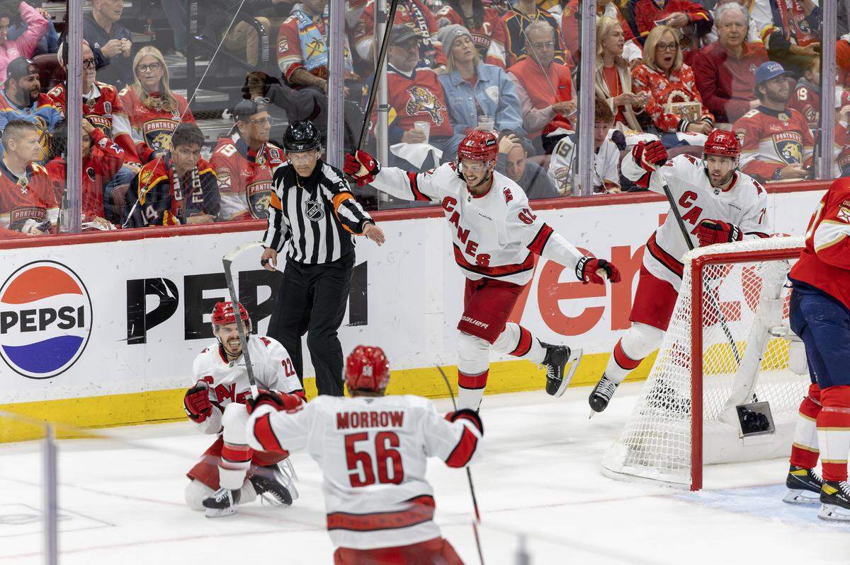 Carolina Hurricanes center Logan Stankoven (22) reacts after scoring in the second period of Game 3 of the Eastern Conference Final against the Florida Panthers during the NHL Stanley Cup Playoffs at Amerant Bank Arena on Saturday, May 24, 2025, in Sunrise, Fla.