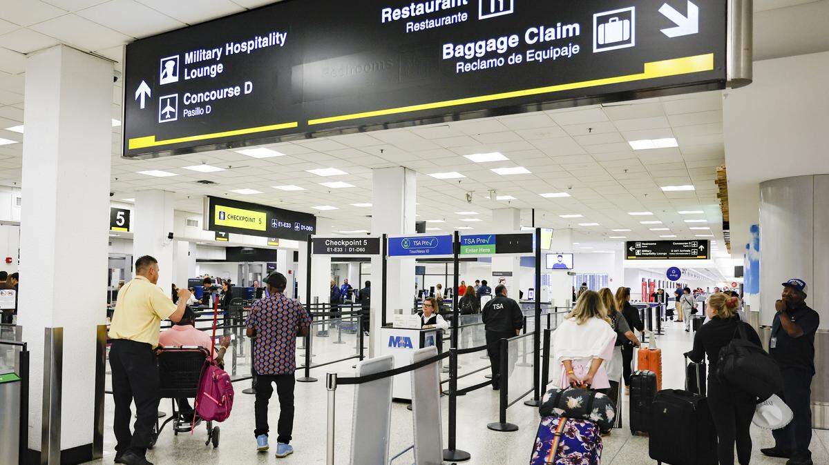 Travelers navigate short TSA lines at Miami International Airport, on Monday morning, March 23, 2026. 