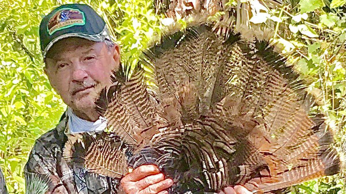 Ron Bergeron with a wild turkey gobbler.