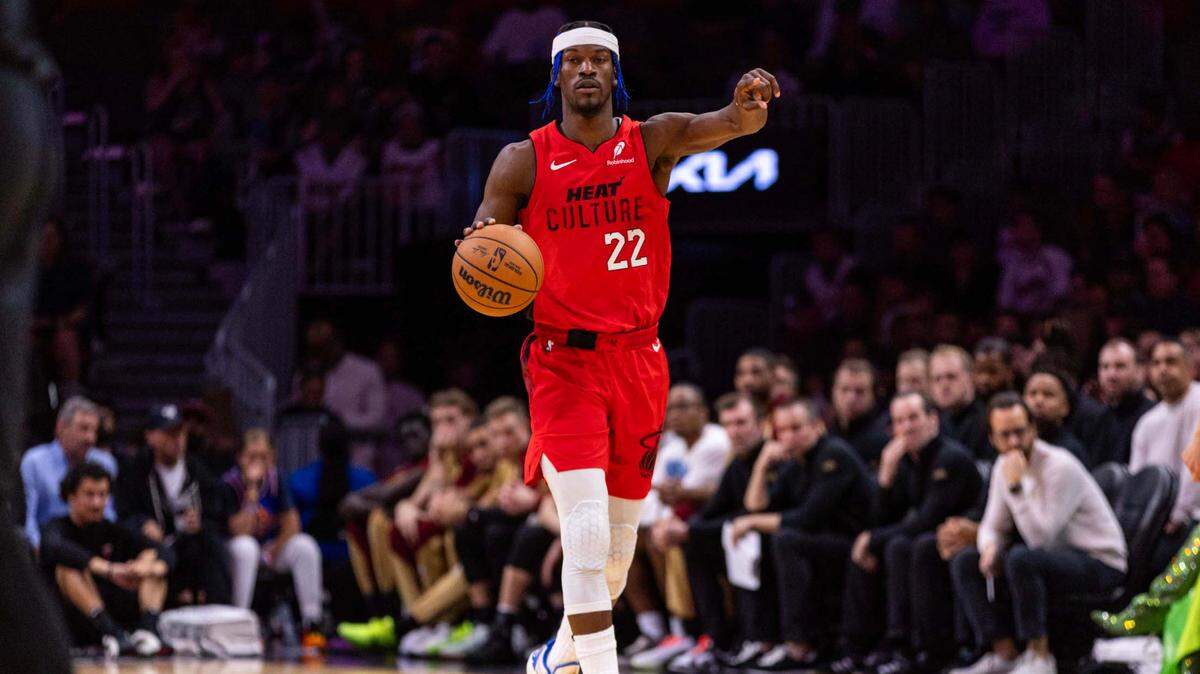 Miami Heat forward Jimmy Butler (22) directs players during the second half of an NBA game against the Cleveland Cavaliers at the Kaseya Center on Sunday, Dec. 8, 2024, in Miami, Fla.
