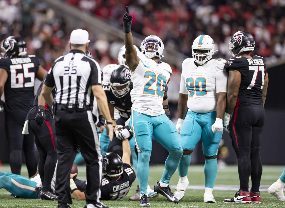 Miami Dolphins linebacker Jordyn Brooks (20) reacts after sacking Atlanta Falcons quarterback Kirk Cousins (18) in the first half of their NFL game at Mercedes-Benz Stadium on Sunday, Oct. 26, 2025, in Atlanta, Ga.