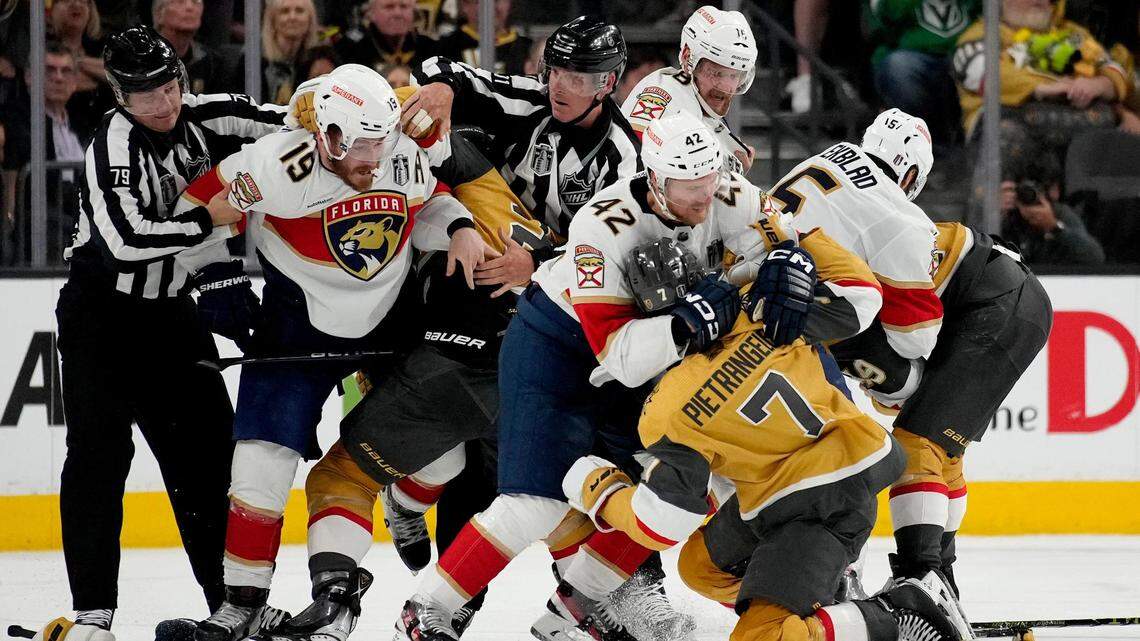 Florida Panthers defenseman Gustav Forsling (42) and Vegas Golden Knights defenseman Alex Pietrangelo (7) fight during the second period of Game 2 of the NHL hockey Stanley Cup Finals, Monday, June 5, 2023, in Las Vegas.