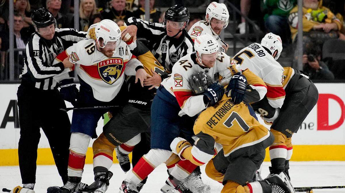 Florida Panthers defenseman Gustav Forsling (42) and Vegas Golden Knights defenseman Alex Pietrangelo (7) fight during the second period of Game 2 of the NHL hockey Stanley Cup Finals, Monday, June 5, 2023, in Las Vegas.