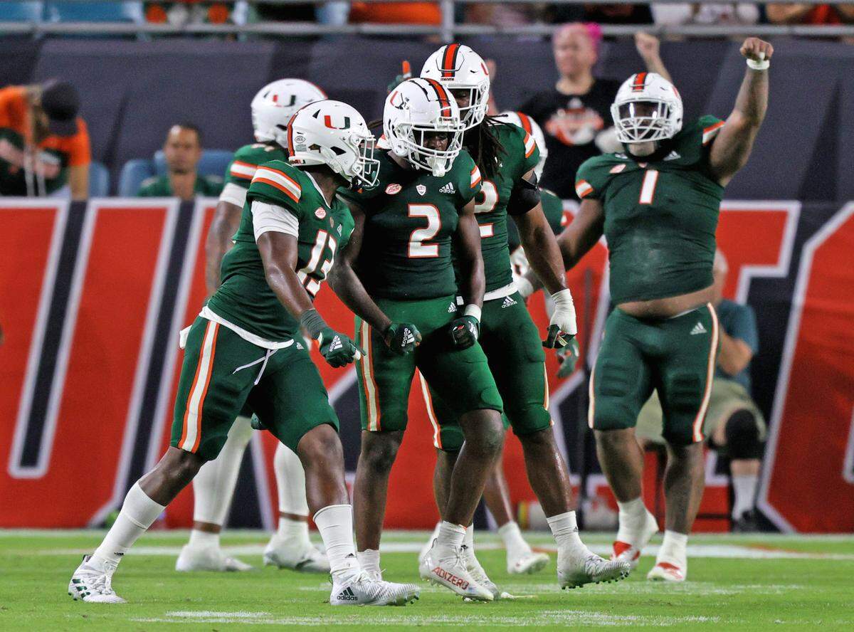 Miami Hurricanes cornerback Tyrique Stevenson (2) celebrate with teammates after a play against the Appalachian State Mountaineers during the third quarter of their ACC football game at Hard Rock Stadium on Saturday, September 11, 2021 in Miami Gardens, Florida.