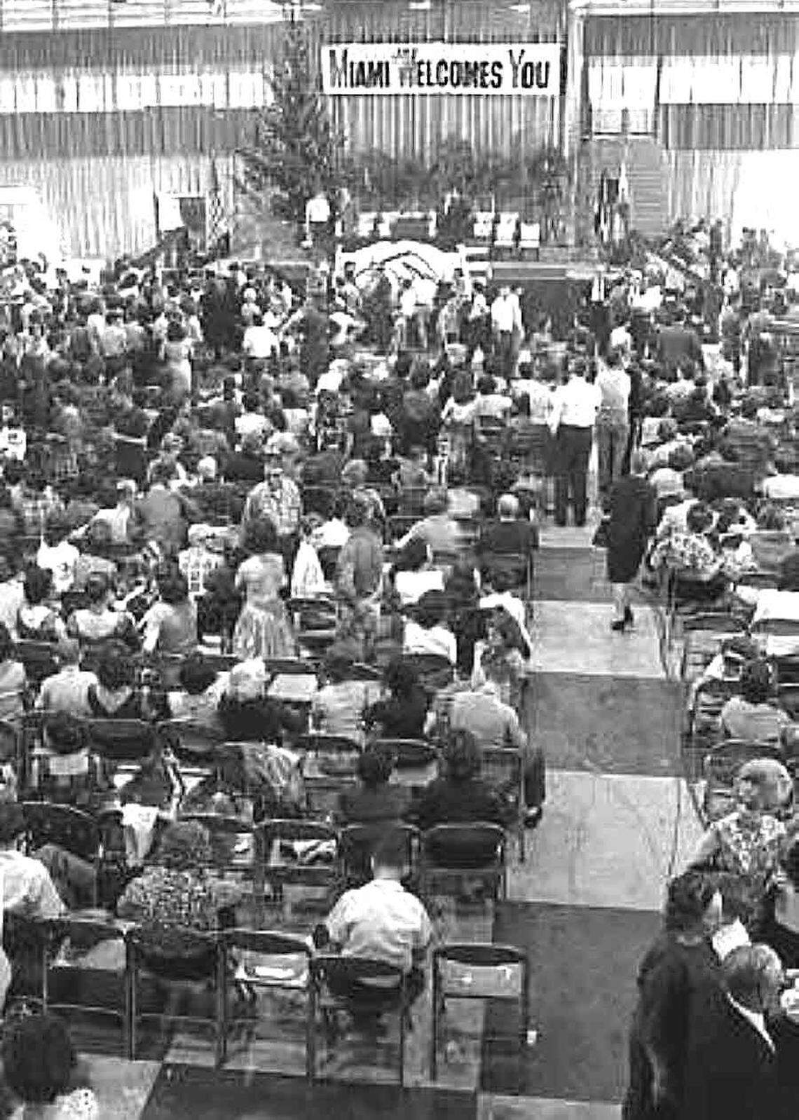 Cuban refugees are processed at Dinner Key Auditorium in Dec. of 1962