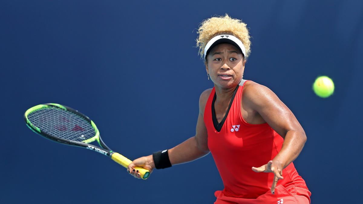 Mari Osaka of Japan returns a shot to Whitney Osuigwe of the United States during their match at Miami Open tennis tournament on Thursday, March 21, 2019 at Hard Rock Stadium in Miami Gardens.