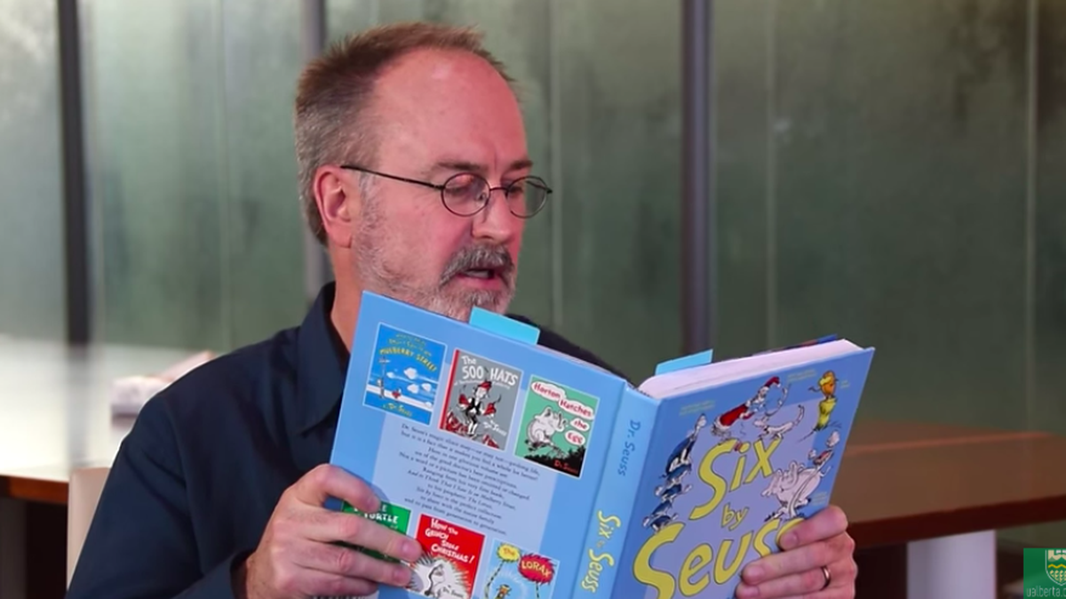Study author Chris Westbury reads from a treasury of Dr. Seuss books. Seuss was famous for using made-up words for humor.