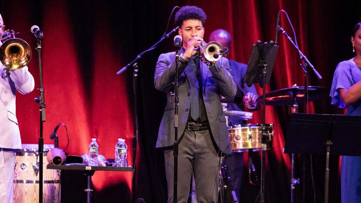 Musical director Jesús “Aguaje” Ramos and his Buena Vista Orchestra, left, seen here in a September performance at New York’s Town Hall, will be playing at the Miami Beach Bandshell on Saturday, Oct. 19.