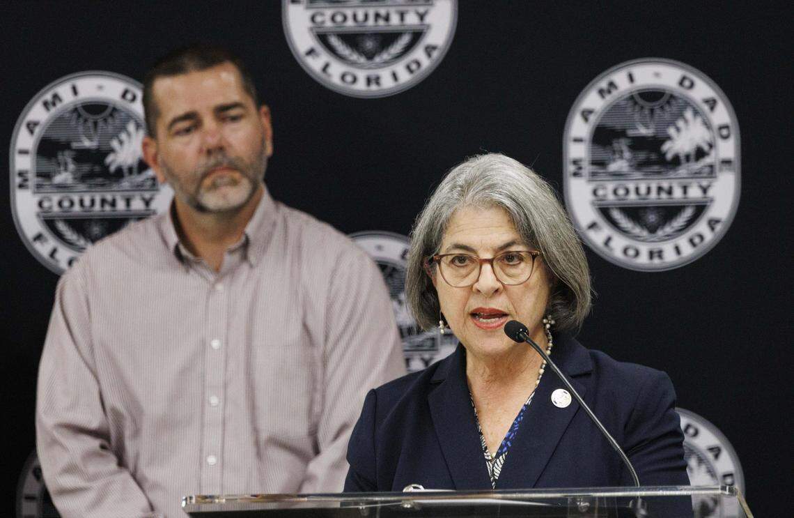Mayor Daniella Levine Cava, front, speaks while Steven Shelley, Farm Share CEO,  listens during a press conference addressing the likely impact of the ongoing federal government shutdown on Supplemental Nutrition Assistance Program (SNAP) benefits on Wednesday, Oct. 29, 2025, at the Office of the Mayor inside the Stephen P. Clark Center in downtown Miami, Fla. SNAP benefits are scheduled to be interrupted starting November 1st. 