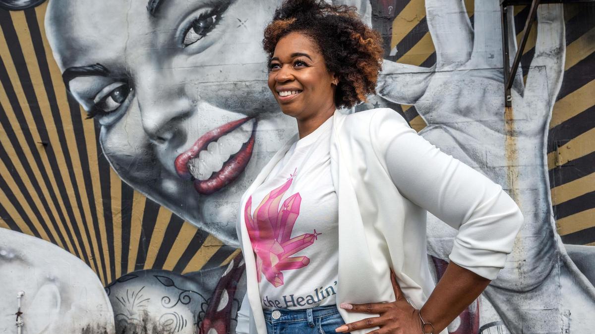 Aurelia Edwards, founder of Nailstry app to size fingernails and buy nail art online, poses in her office in Fort Lauderdale on April 20, 2022.