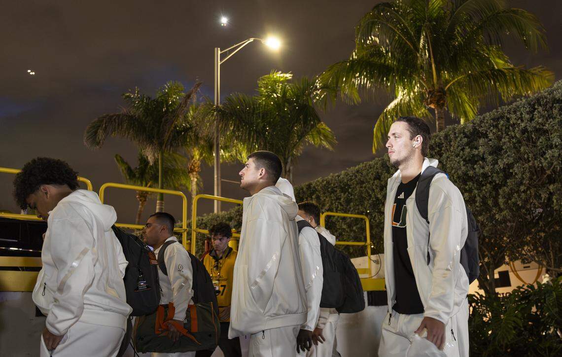 Miami Hurricanes quarterback Carson Beck (11) arrives with his teammates to the Fontainebleau Miami Beach ahead of their College Football Playoff National Championship Game against the Indiana Hoosiers on Friday, Jan. 16, 2026, in Miami Beach, Fla.