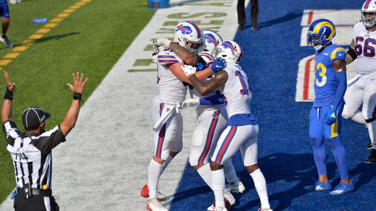 Buffalo Bills’ Tyler Kroft, left, celebrates with teammates after catching a pass for a touchdown during the second half of an NFL football game against the Los Angeles Rams Sunday, Aug. 26, 2018, in Orchard Park, N.Y. The Bills won 35-32.