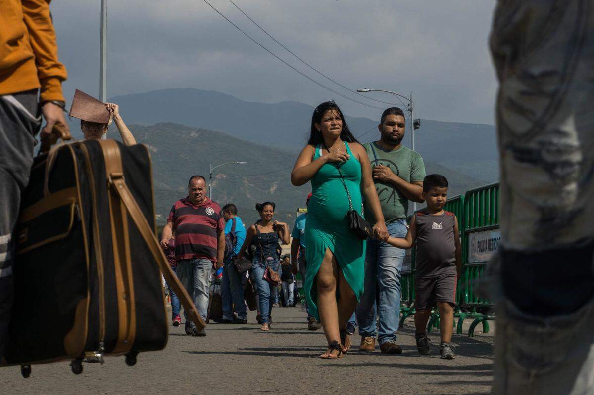 Families are fleeing economic meltdown and unrest in Venezuela, while gold traffickers use the exodus to get wealthy.