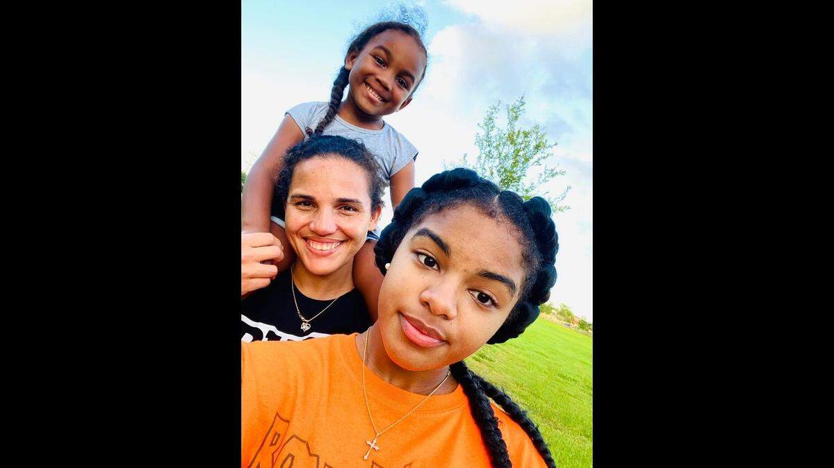 Valerie Salnave, an oncology nurse at Baptist Health’s Miami Cancer Institute, with her two daughters, Anais, 17, and McKenzie, 5. Salnave donated part of her liver to a stranger in need.