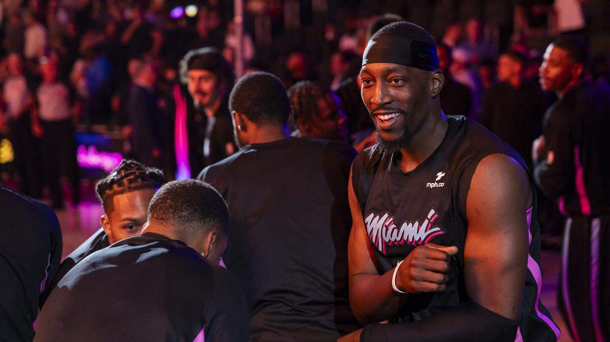 Miami Heat center Bam Adebayo (13) huddles with his teammates before their NBA game against the Golden State Warriors at Kaseya Center on Nov. 19, 2025, in Miami.