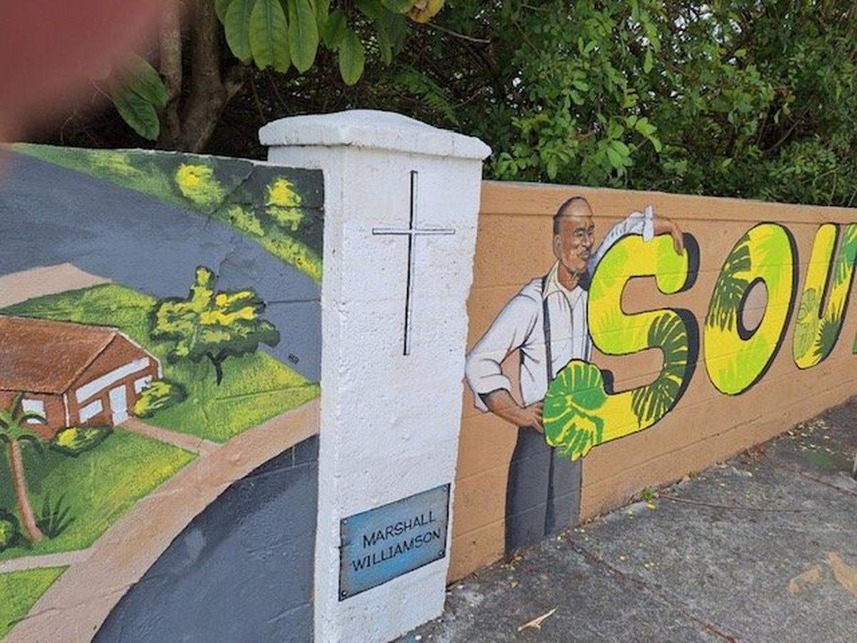 Gail Alexander, working with five women, transformed a wall in South Miami that had once separated Black residents from white ones. The mural features Marshall Williamson, known as the ‘Little Mayor,’ and former Black-owned businesses along Southwest 59th Place. The wall stretches along Southwest 64th Street and includes a portion of Southwest 62nd Avenue.