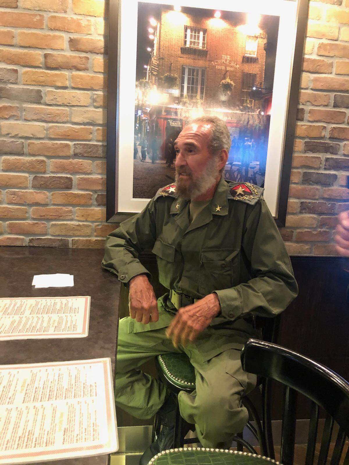 Cairo Sandino, a Nicaraguan who now lives in Miami, sits at a pub in Miami International Airport on Wednesday, June 5, 2019.