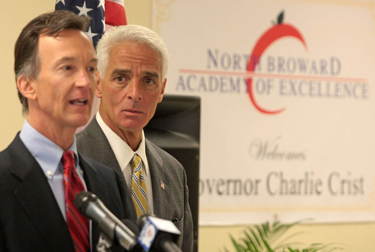 Then-state representative Tom Grady (L) speaking at the North Broward Academy of Excellence before then Gov. Charlie Crist (R) signed the 2009 School Improvement and Accountability Bill.