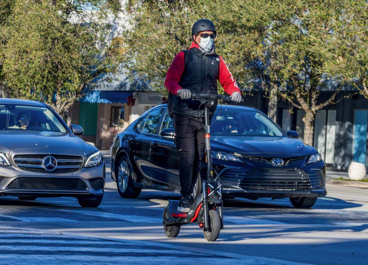 The cold temperatures didn't stop a man from riding his scooter along Miracle Mile in Coral Gables, as Miami woke to one of its coldest New Year's Eves in decades, on Wednesday, December 31, 2025. 