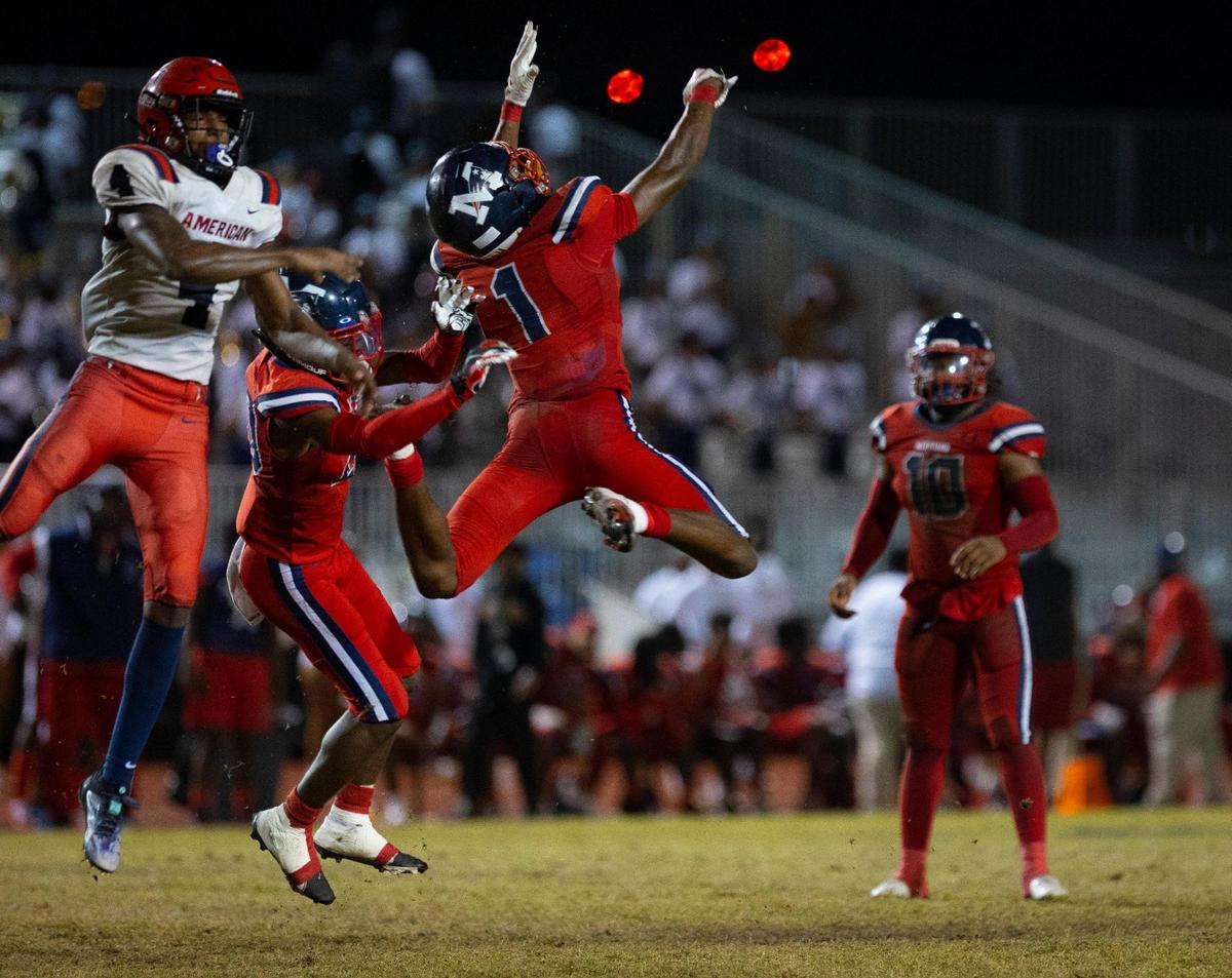 Miramar’s Caleb Solomon (1) jumps up to attempt a catch during the fourth quarter of a playoff game between American and Miramar on Thursday, Nov. 9, 2023, at Miramar High School.