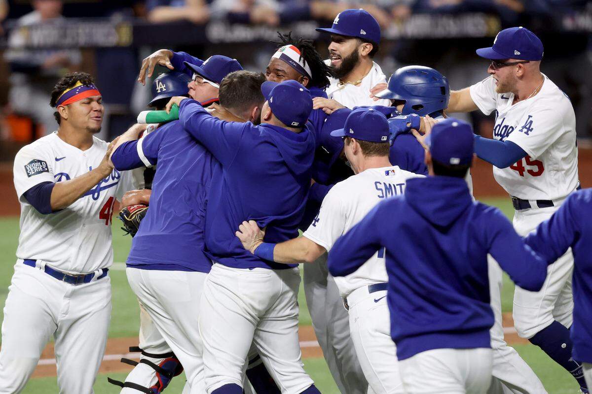 ARLINGTON, TEXAS - OCTOBER 27: The Los Angeles Dodgers celebrate after defeating the Tampa Bay Rays 3-1 in Game Six to win the 2020 MLB World Series at Globe Life Field on October 27, 2020 in Arlington, Texas. (Photo by Tom Pennington/Getty Images)