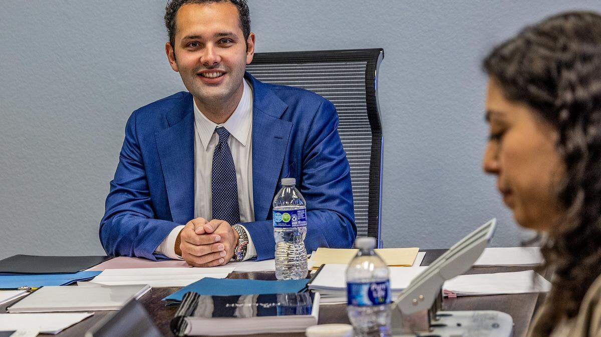 Hialeah Mayor-elect Bryan Calvo works with members of his team at a temporary office in a conference room inside City Hall, ahead of his swearing ceremony on Jan. 12th.