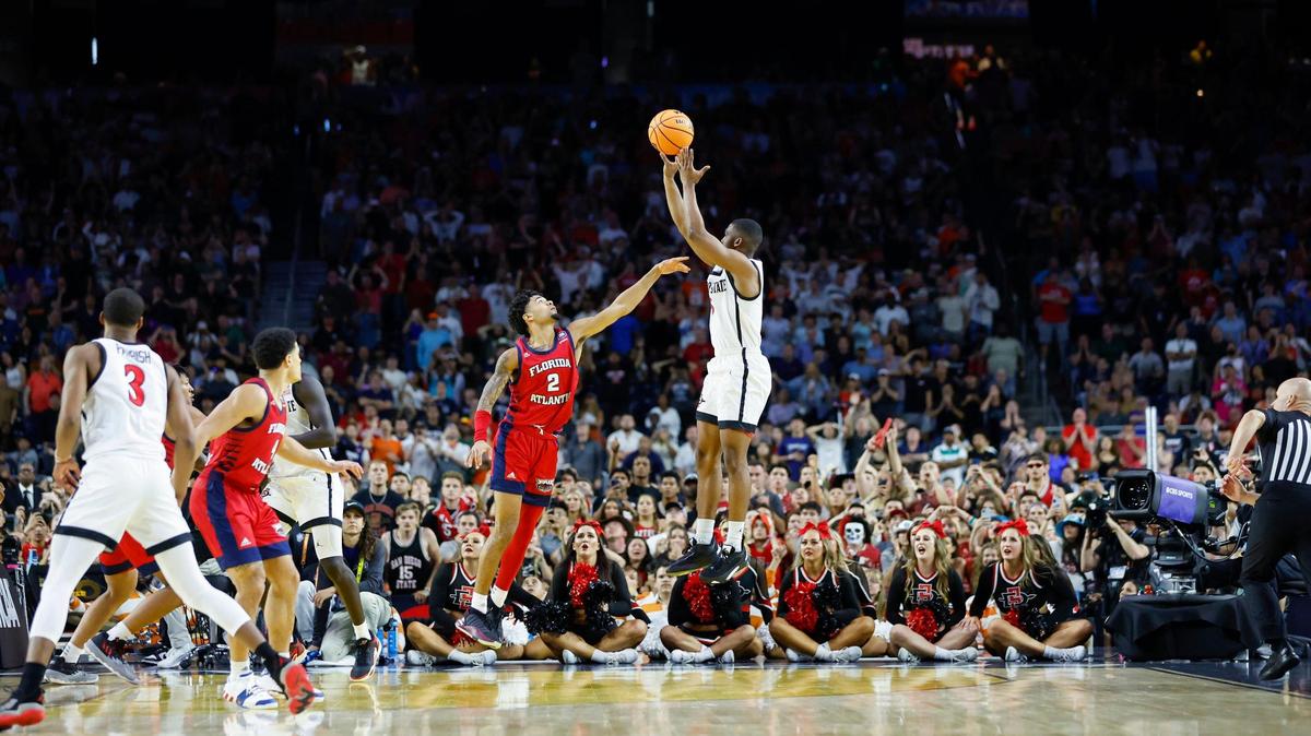 San Diego State Aztecs guard Lamont Butler (5) hits the winning shot over Florida Atlantic Owls guard Nicholas Boyd (2) during the second half of the Men’s Basketball Championship National Semifinal at NRG Stadium in Houston, Texas on Saturday, April 1, 2023.