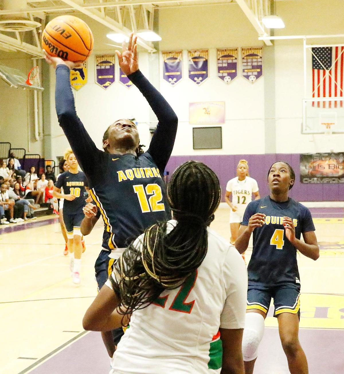 St. Thomas Aquinas Raiders Reina Green (12) goes for a shot against Blanche Ely Tigers during the BCAA Big 8 Girls’ 2023 Basketball championship game on Saturday, January 28, 2023 at South Plantation HS in Plantation. Andrew Uloza / for Miami Herald