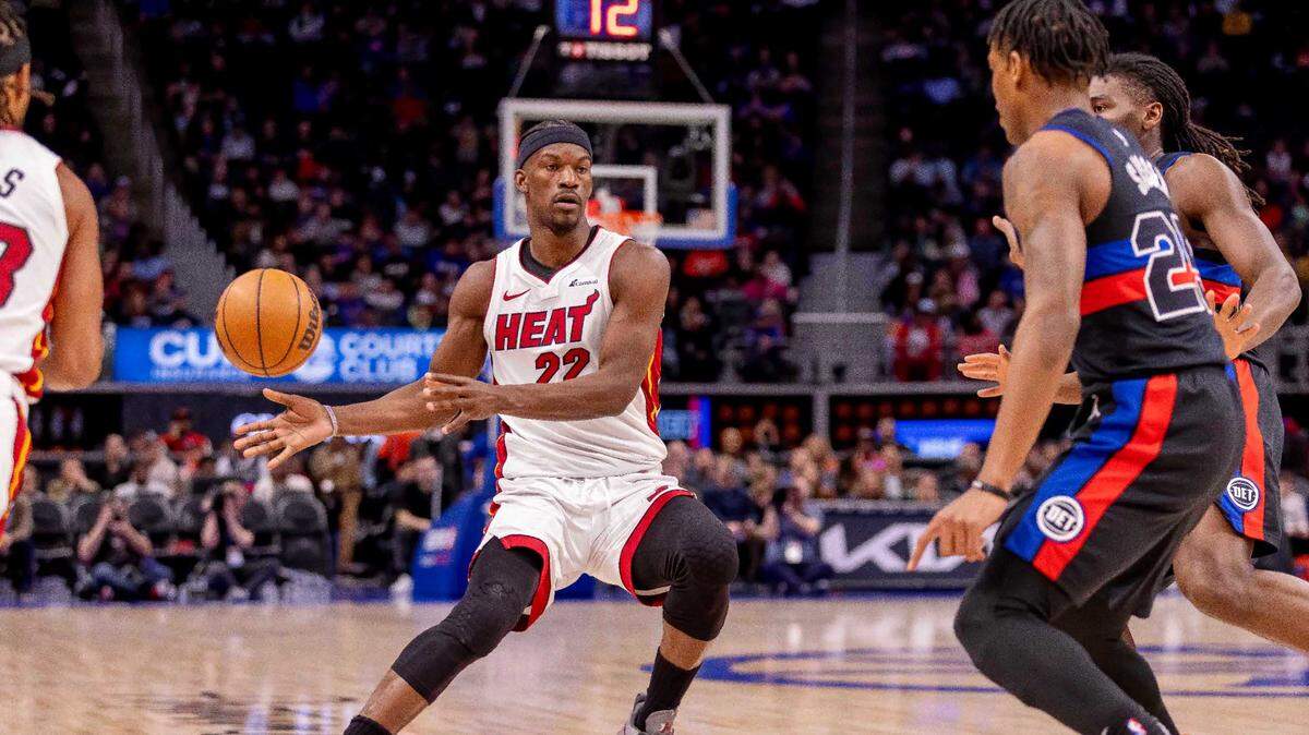 Miami Heat forward Jimmy Butler (22) passes the ball against the Detroit Pistons during the first quarter at Little Caesars Arena.
