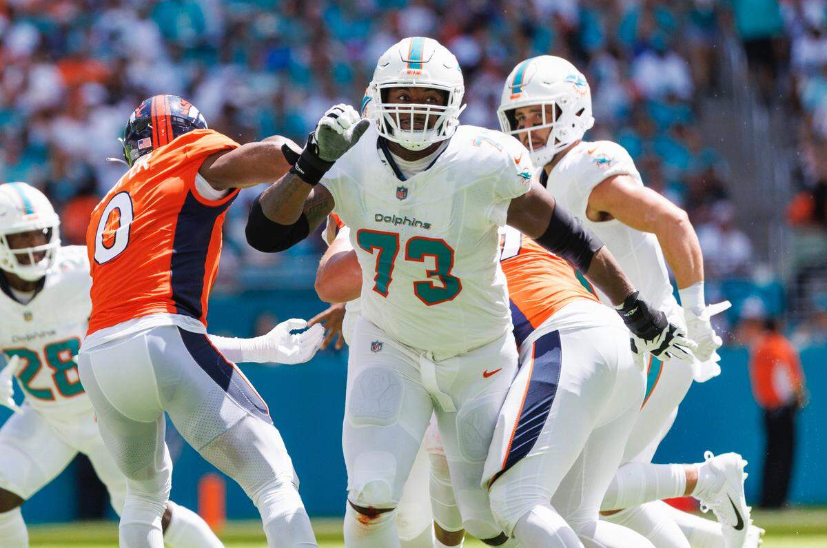 Miami Dolphins guard Austin Jackson (73) blocks Denver Broncos linebacker Jonathon Cooper (0) during second quarter of an NFL football game at Hard Rock Stadium on Sunday, Sept. 24, 2023 in Miami Gardens, Fl.