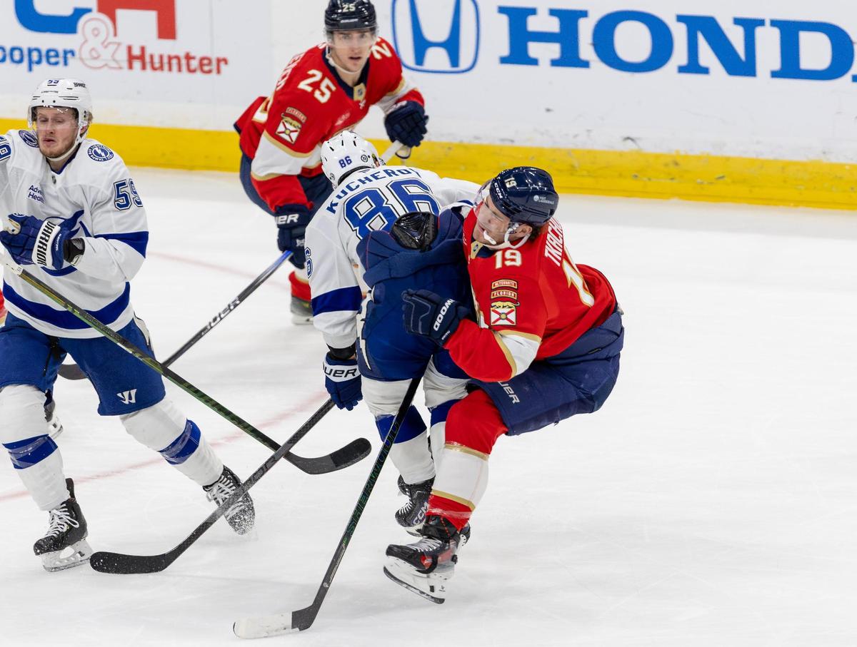 Tampa Bay Lightning right-wing Nikita Kucherov (86) makes a hit against Florida Panthers left-wing Matthew Tkachuk (19) during first-period action in an NHL game held at Amerant Bank Arena on Monday, December 23, 2024, in Sunrise, Florida.”