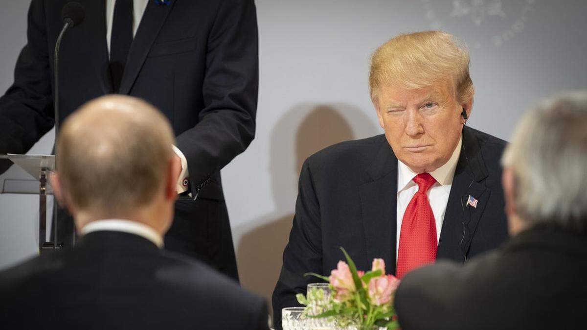 President Trump, facing Putin, has been seen as currying favor with the Russian leader.