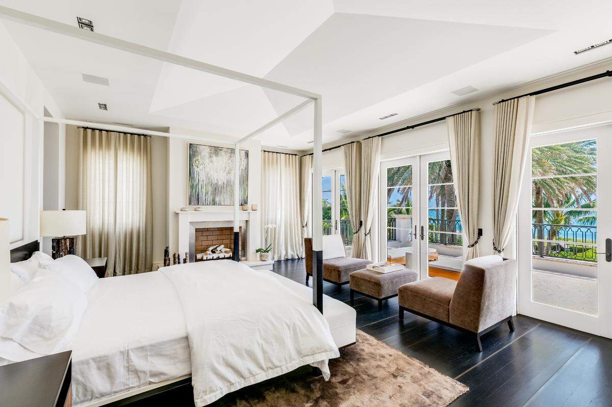The 7,000-square-foot house has five bedrooms, six bathrooms and a powder room. Above: A look inside the master bedroom.