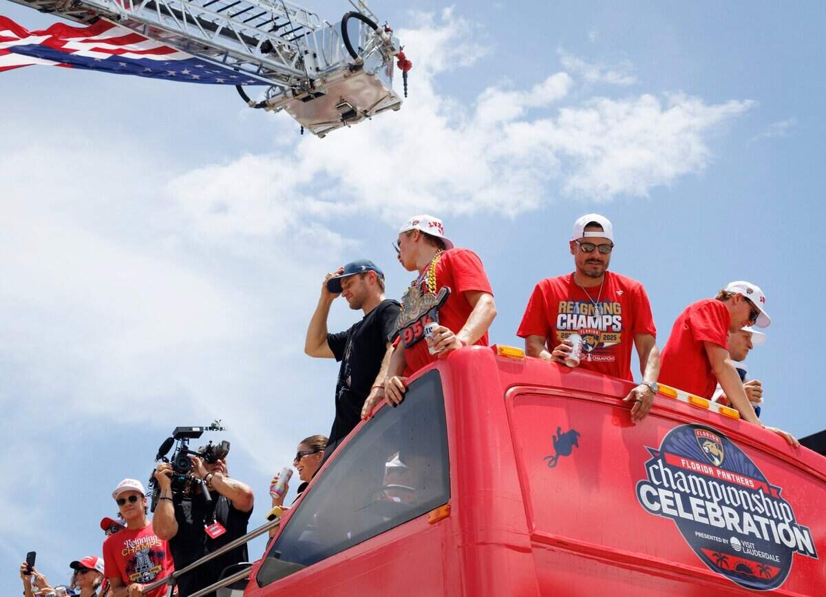 Florida Panthers center Aleksander Barkov (16) and other players ride on a bus and wave to fans during the Florida Panthers Stanley Cup Championship victory parade on Sunday, June 22, 2025 down Las Olas in Fort Lauderdale, Fla.