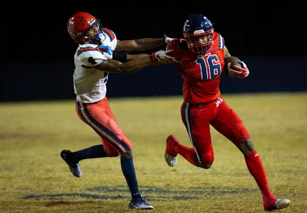 Miramar’s Nehemiah Pittman (16) runs the ball passed American’s Shamar Fowles (4) during the third quarter of a playoff game between American and Miramar on Thursday, Nov. 9, 2023, at Miramar High School.
