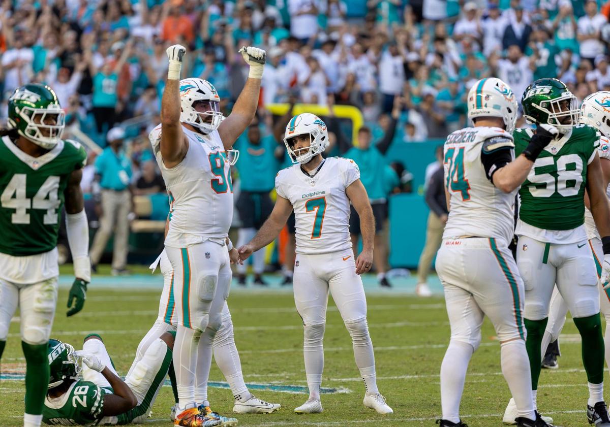 Miami Dolphins placekicker Jason Sanders (7) celebrates with teammates after successfully kicking a field goal to tie the game during the second half of their NFL matchup against the New York Jets at Hard Rock Stadium on Sunday, Dec. 8, 2024, in Miami Gardens, Florida.