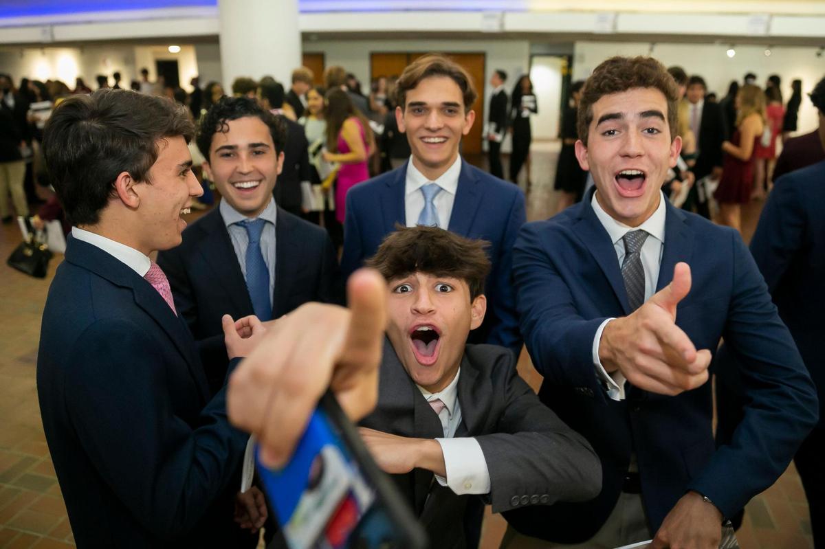 Antonio Bonadies, 18, bottom center, from Belen Jesuit Preparatory School, reacts before the start of the 64th Annual Silver Knight Awards presented by the Miami Herald & el Nuevo Herald at the James L. Knight Center in downtown Miami on Thursday, May 26, 2022. Bonadies was attending the ceremony in support of his friend Carlos Morales, who won the Miami-Dade Silver Knight in Athletics.
