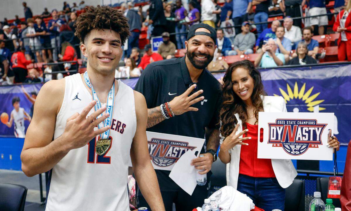 Columbus’ Cameron Boozer (12) celebrates with parents Carlos and Cece Boozer after Columbus defeats Windermere for the FHSAA Class 7A Final for Boys High School Basketball State Championship at the RP Funding Center in Lakeland, Florida on Saturday, March 8, 2025.