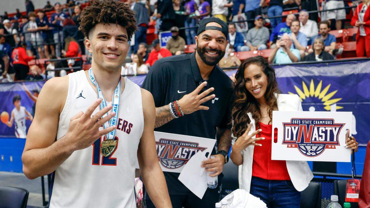 Columbus’ Cameron Boozer (12) celebrates with parents Carlos and Cece Boozer after Columbus defeats Windermere for the FHSAA Class 7A Final for Boys High School Basketball State Championship at the RP Funding Center in Lakeland, Florida on Saturday, March 8, 2025.